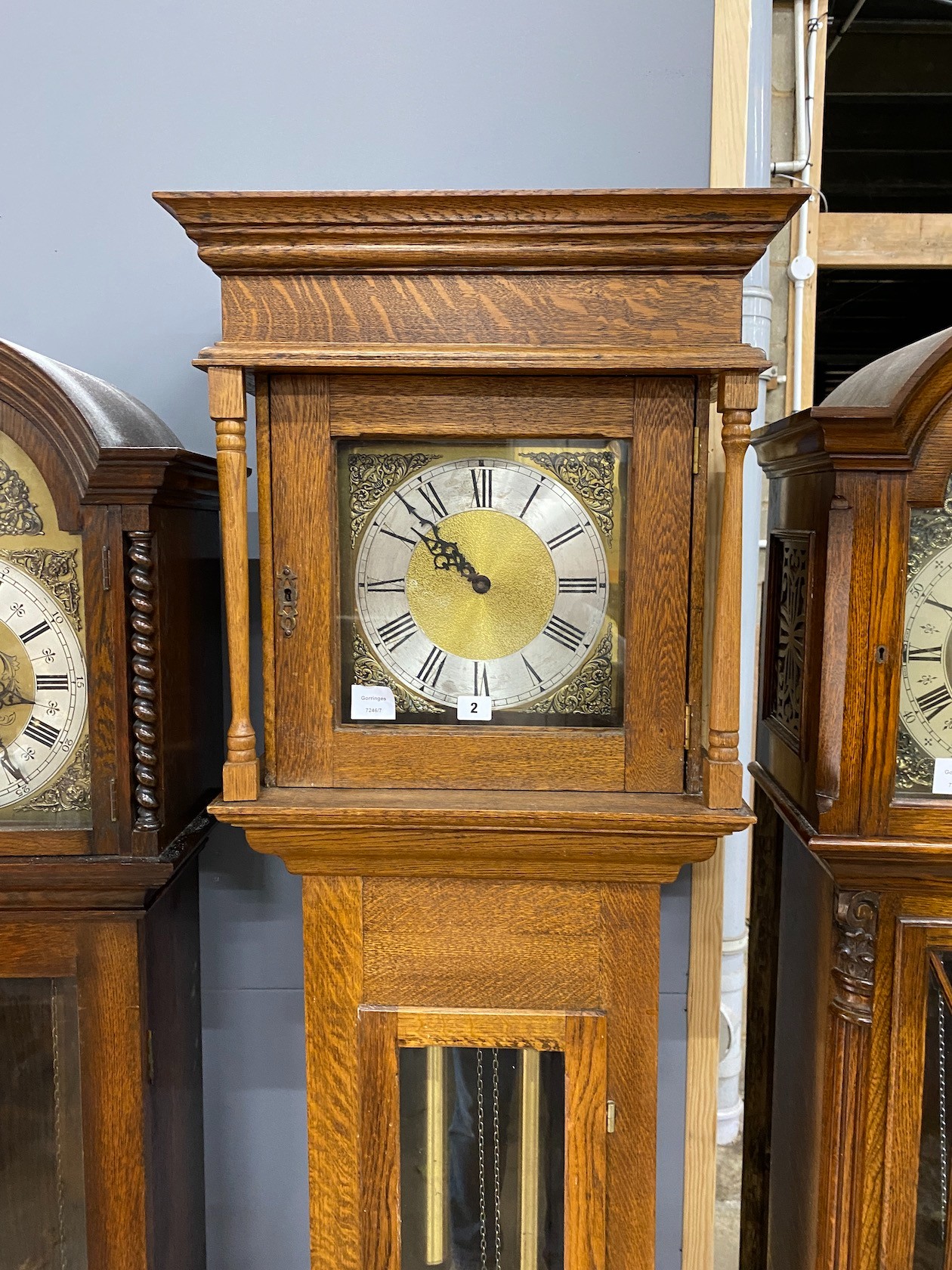 An oak longcase clock, with a square brass and silvered dial, height 203cm